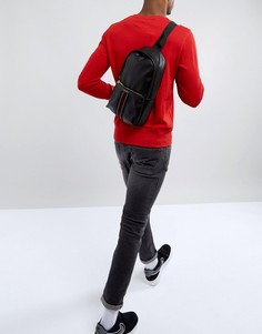 Черный рюкзак через плечо из искусственной кожи с отделкой в полоску на кармане ASOS DESIGN - Черный