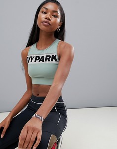 Светло-зеленый спортивный бюстгальтер с флоковым принтом Ivy Park - Синий