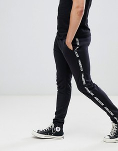 Черные спортивные штаны с фирменной лентой по бокам Hollister - Черный