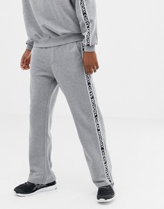 Серые спортивные штаны с фирменной лентой из комплекта Cheap Monday - Серый