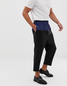 Черные шерстяные брюки заниженного кроя со вставками ASOS DESIGN - Черный