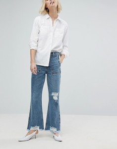 Укороченные расклешенные джинсы с необработанными краями EVIDNT - Синий
