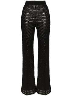 Situationist Zig-zag knit flared high-waisted trousers