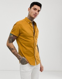 Облегающая джинсовая эластичная рубашка горчичного цвета ASOS DESIGN - Желтый