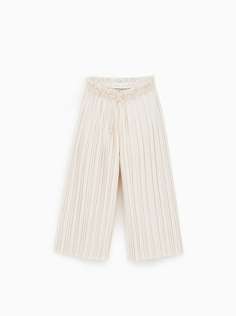 Плиссированные брюки с блеском Zara