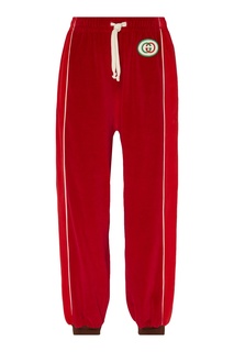 Широкие спортивные брюки красного цвета Gucci