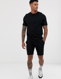 Черный спортивный костюм из топа с отворотами на рукавах и коротких шортов ASOS DESIGN - Черный