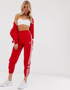 Красные спортивные штаны с логотипом adidas Originals adicolor locked up - Красный