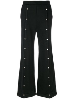 T By Alexander Wang брюки клеш с заклепками