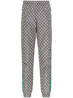 Gucci спортивные брюки с узором GG Supreme и отделкой Web