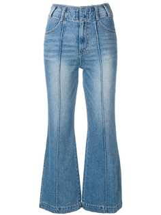 SJYP укороченные расклешенные джинсы