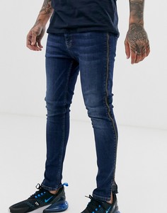 Темно-синие эластичные джинсы с напылением и молниями по бокам ASOS DESIGN - Синий