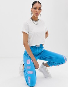 Свободные джоггеры с принтом пламени и логотипа New Girl Order - Синий