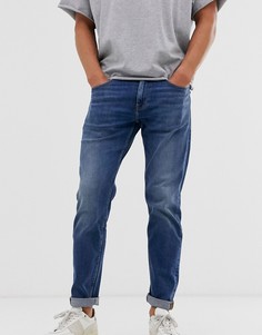Темно-синие выбеленные суженные книзу джинсы ASOS DESIGN - Синий