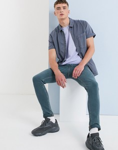 Сине-зеленые супероблегающие джинсы ASOS DESIGN - Синий