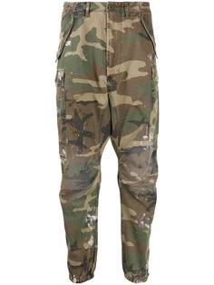 R13 camouflage print trousers