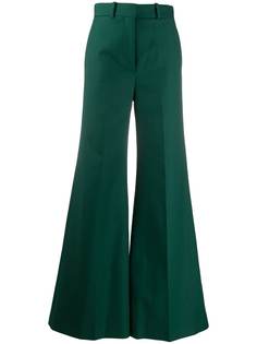 Khaite расклешенные брюки с завышенной талией