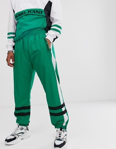 Зеленые спортивные штаны в стиле ретро с полосками Karl Kani
