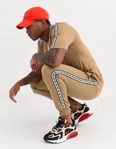 Джоггеры песочного цвета с манжетами и отделкой лентой Nike