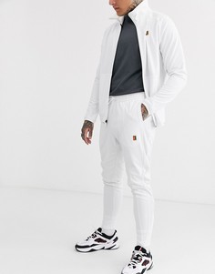 Белые джоггеры Nike Court Essential
