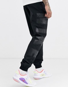 Черные джоггеры с манжетами и логотипом Nike Social Currency