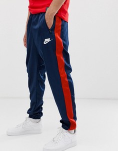 Темно-синие спортивные штаны с логотипом и полосками по бокам Nike-Темно-синий