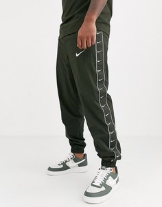 Джоггеры цвета хаки с манжетами и отделкой лентой Nike-Зеленый