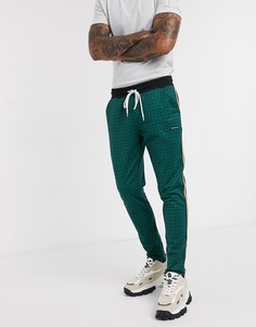 Зеленые брюки с геометрическим узором и атласной лентой по бокам Good for Nothing-Зеленый