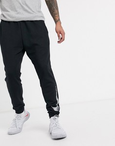 Суженные книзу черные джоггеры из ткани Dri-Fit от Nike Training-Черный