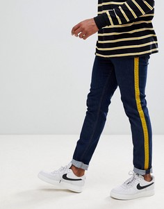 Темные зауженные джинсы с велюровыми полосками горчичного цвета по бокам ASOS DESIGN-Синий