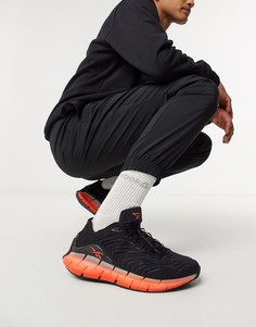 Черные/оранжевые кроссовки Reebok Zig Kinetica-Черный