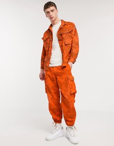 Оранжевые брюки-карго с камуфляжным принтом Milk It Vintage-Оранжевый
