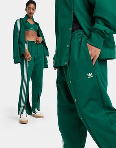 Темно-зеленые спортивные брюки с отделкой на кнопках adidas x Ivy Park-Зеленый