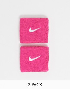 Розовый напульсник с логотипом-галочкой Nike Training