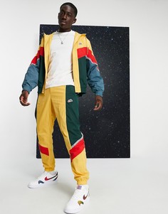 Джоггеры горчичного цвета с манжетами от костюма 19 Nike Heritage Essentials Windrunner-Желтый