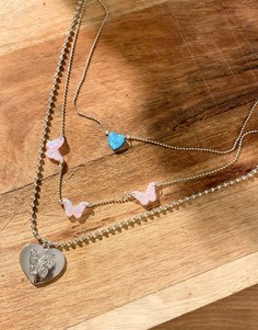 Серебристое ярусное ожерелье с овальными подвесками и подвеской в виде середечка-бабочки ASOS DESIGN-Серебряный