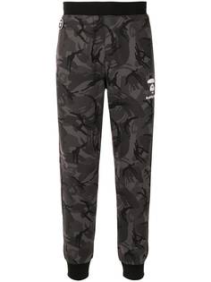 AAPE BY *A BATHING APE® спортивные брюки с камуфляжным узором