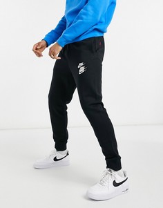 Черные джоггеры с графическим принтом и манжетами Nike World Tour Pack S18-Черный цвет