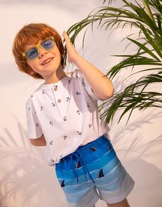 Голубые пляжные шорты с принтом для мальчика Gloria Jeans