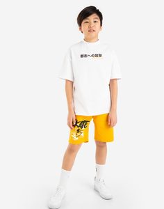 Жёлтые шорты с принтом Skate и поясом на фастексе для мальчика Gloria Jeans