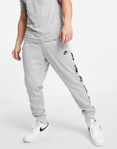 Серые джоггеры из политрикотажа с отделкой тесьмой Nike Repeat-Серый