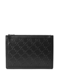 Gucci клатч с тиснением GG