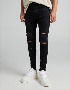 Черные супероблегающие джинсы с прорехами и необработанным краем Bershka-Черный цвет