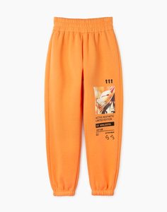 Оранжевые спортивные брюки Jogger с аниме-принтом и нашивкой для девочки Gloria Jeans