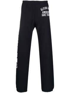 Champion спортивные брюки с графичным принтом