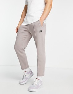 Суженные книзу джоггеры серо-бежевого цвета с логотипом Nike Club-Серый