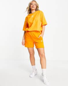 Оранжевые шорты с логотипом adidas Originals Essentials