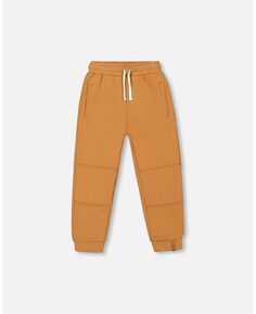 Флисовые спортивные штаны с карманами для мальчика карамельного цвета - детские Deux par Deux