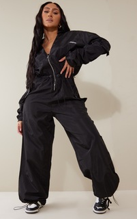 PrettyLittleThing Черный комбинезон с широкими штанинами и карманами в форме ракушки