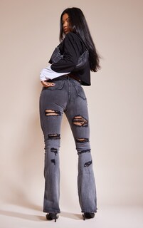 PrettyLittleThing Выстиранные черные расклешенные джинсы с высокой посадкой и потертостями на спине